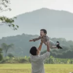 father-son-playing-park-sunset-time-people-having-fun-field-concept-friendly-family-summer-vacation